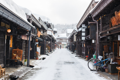 Wooden houses in the historic town of Takayama in Japan on winter day.