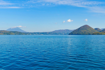 Toyako spa town, at the foot of an impressive volcano and on the shore of a beautiful lake that occupies an old crater